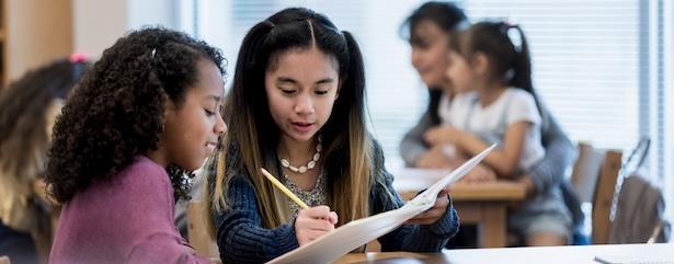 female students helping each other