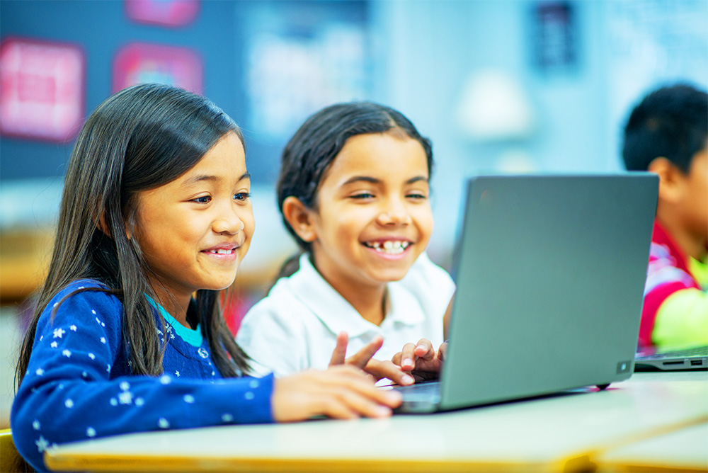  two female students working together